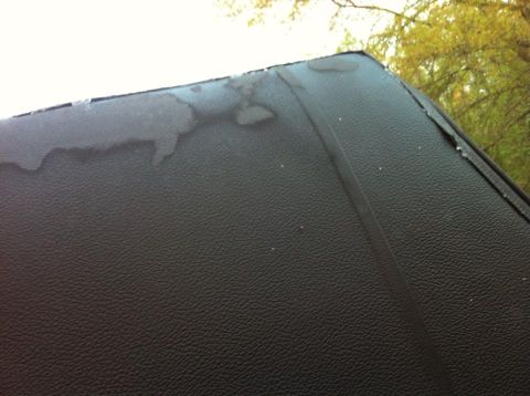 1979 Ford Ranchero - Close-up of a black vinyl top showing water stains and wear.