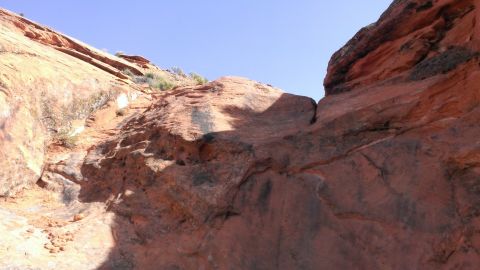 1994 Ford Bronco - Desert landscape with prominent red rock formations and a clear blue sky.