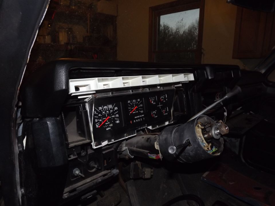 Dashboard with gauges removed, steering column visible