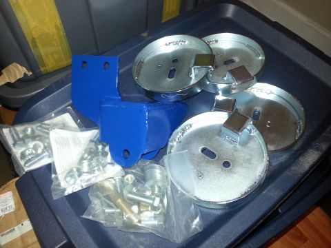 1989 Ford Bronco - Air suspension components and assorted hardware are laid out on a dark tray.