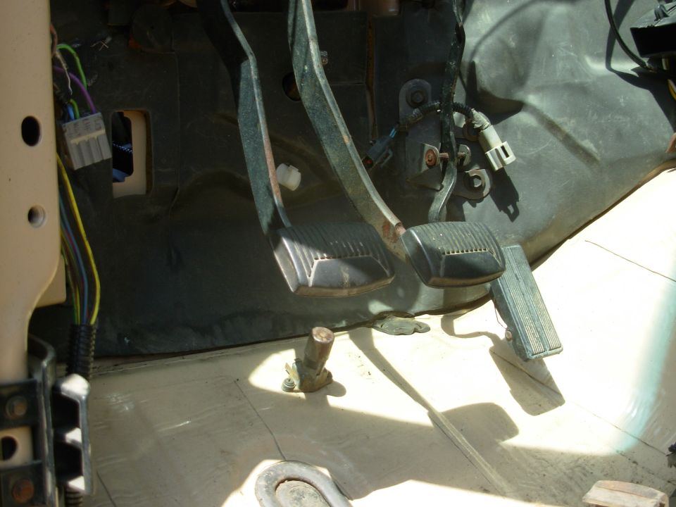 This old high beam switch is now my clutch switch defeat so I can still drive on the starter if I have to.  It's out of the way under the brake pedal, but still accessible & intuitive.