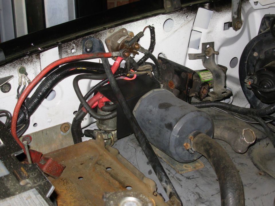 The aux.batt. relays are under the plastic shield, which should prevent shorting on the heavy posts.  The smog pump filter was moved about 1/4" inboard.  The extra ring on the green stud (far Left/front) is for the trunk ground that loops the engine bay & connects all the ground points (& the L fender which had no ground from the factory) to the battery (-) post by wire.