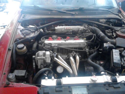 1990 Toyota Celica engine bay with EFI label