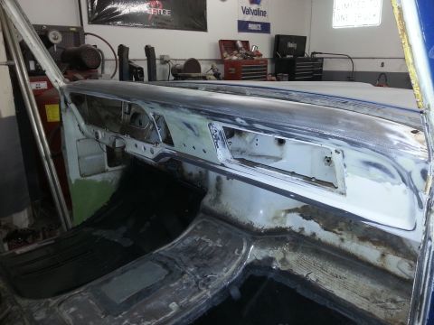 1967 Ford F-100 - The interior of a vehicle is shown with bodywork and repairs underway, revealing the dashboard and floor.