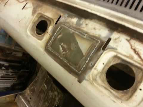 1967 Ford F-100 - This 1967 Ford F-100 shows a welded patch on its cowl panel, indicating body repair work.