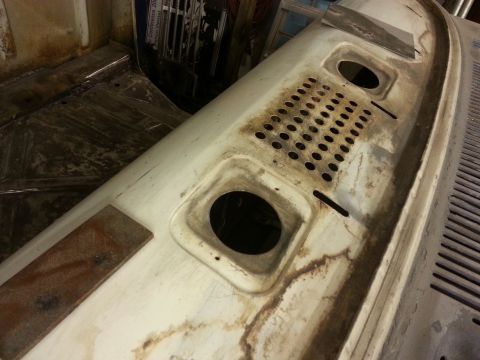 1967 Ford F-100 - This is a close-up view of a truck cowl panel, showing its condition and features.