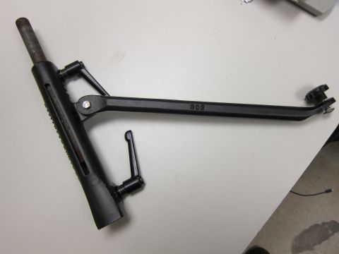 1991 Ford LTD Crown Victoria - A close-up view of a black adjustable metal bracket with visible markings and levers.