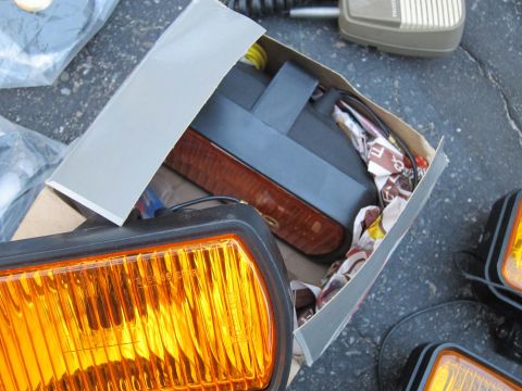 1991 Ford LTD Crown Victoria - Amber parking lights are shown in packaging, along with other vehicle parts.