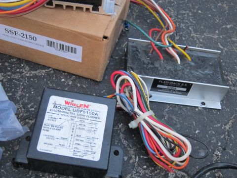 1991 Ford LTD Crown Victoria - Two electronic flasher units, one Whelen UBF5150A and one SSF-2150, with associated wiring are shown.