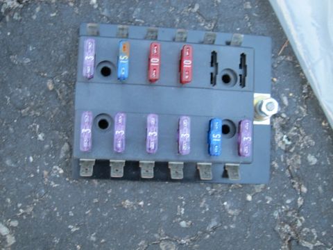 1991 Ford LTD Crown Victoria - A close-up view of a vehicle's fuse box, showing various fuses with their amperage ratings clearly visible.