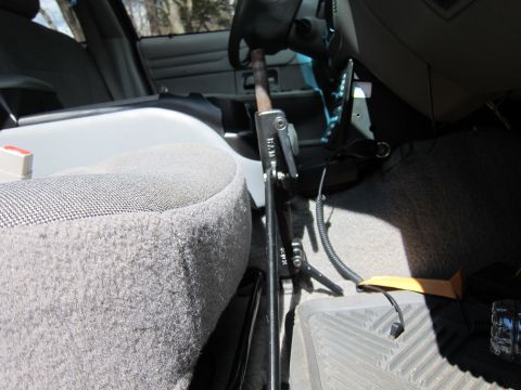 1991 Ford LTD Crown Victoria - Interior view of a 1991 Ford Crown Victoria LTD, likely a police vehicle, with equipment mounted on the console.