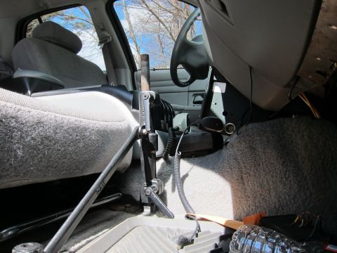 1991 Ford LTD Crown Victoria - The interior of a 1991 Ford Crown Victoria LTD police car, equipped with a radio and other law enforcement gear.