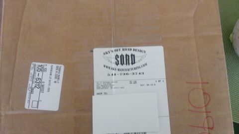 1994 Ford Bronco - A cardboard box is shown with shipping labels and branding from Sky's Off Road Design.
