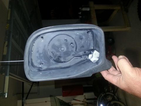 1994 Ford Bronco - The interior mounting points of a car's side mirror housing are visible.