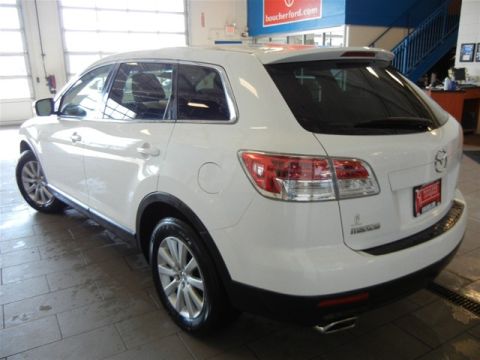 2008 Mazda CX-9 - Rear 3/4 view of a white 2008 Mazda CX-9 SUV, showing its taillights and rear bumper.