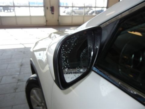 2008 Mazda CX-9 - Side mirror of a white SUV shows water droplets on its surface. The image includes a watermark for SUPERMOTORS.NET.