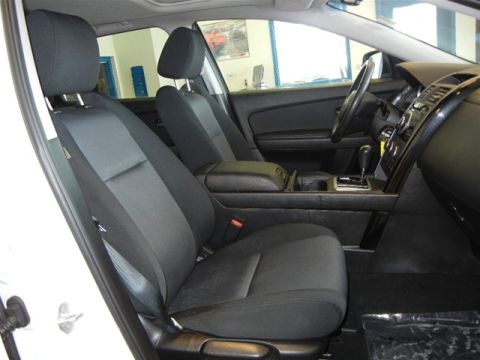 2008 Mazda CX-9 - Front seats and dashboard of a 2008 Mazda CX-9, offering a view of the interior controls and seating arrangement.