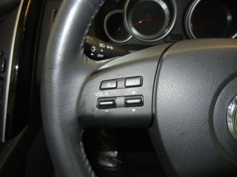2008 Mazda CX-9 - Interior view of a 2008 Mazda CX-9 steering wheel, showing audio controls.