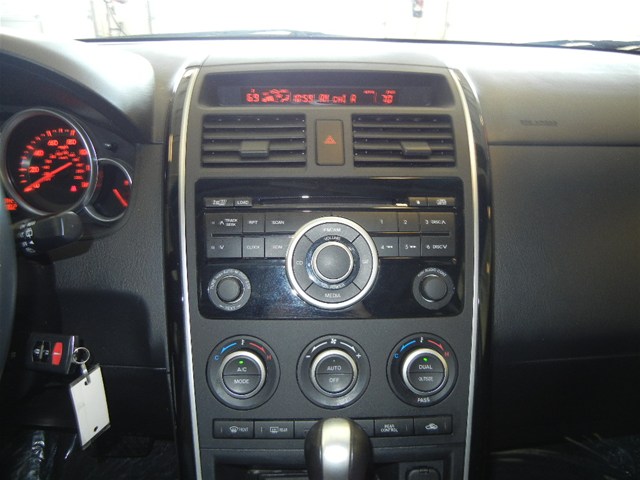 2008 Mazda CX-9 interior showing dashboard, instrument cluster, and center console with radio and climate controls