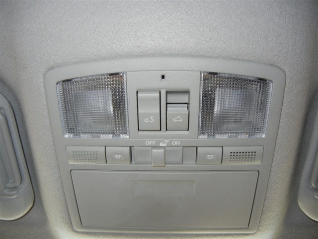 Overhead console with two map lights, two sunroof buttons, and multiple smaller buttons labeled OFF and ON