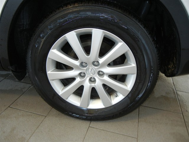 Close-up of a 2008 Mazda CX-9 wheel and tire