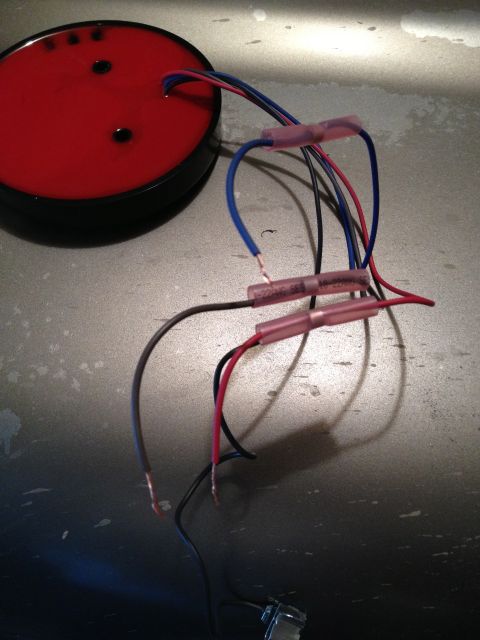 2005 Jeep Wrangler - Close-up of a red automotive light assembly with multiple colored wires and connectors.
