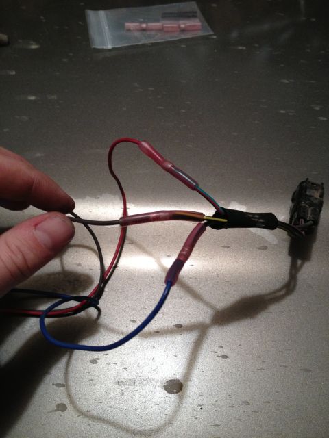 2005 Jeep Wrangler - A close-up shows a wiring harness with multiple connections made using heat shrink tubing.