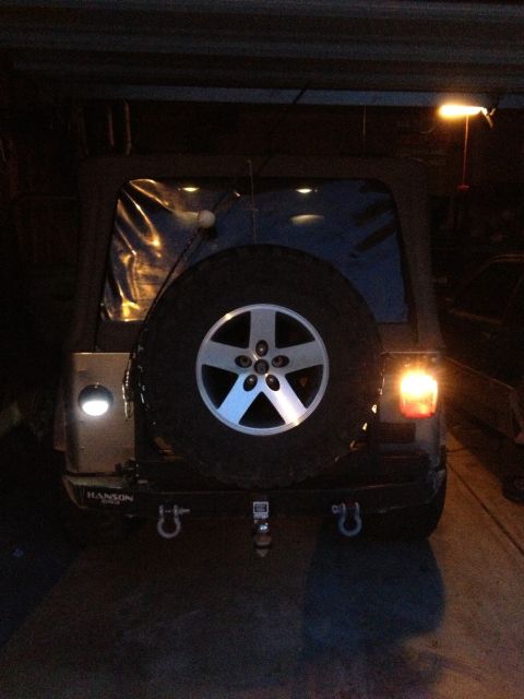 2005 Jeep Wrangler - Rear view of a Jeep Wrangler showing its spare tire, bumper, and tow hitch.