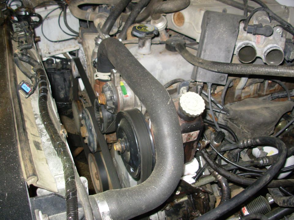 It's idling smoothly here, and I let it go a minute or 2 after the t-stat opened.  The e-fan wiring, connectors, & resistor are thrown on top of the radiator.  The Magnefine filter is for the Saginaw PS fluid, and the distributor is booted.
[url=https://www.amazon.com/dp/B000O0WSJW]Rubber Distributor Cover E6TZ-12252-A[/url]