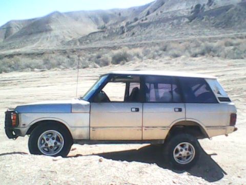 1991 Land Rover Range Rover - This 1991 Land Rover Range Rover is seen in a desert environment, highlighting its off-road capabilities.