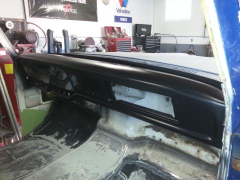1967 Ford F-100 - The interior of a truck is being worked on, with the dashboard and floor exposed.