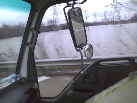 2003 Ford Crown Victoria - Driving through floodwaters from the perspective of a truck's interior.