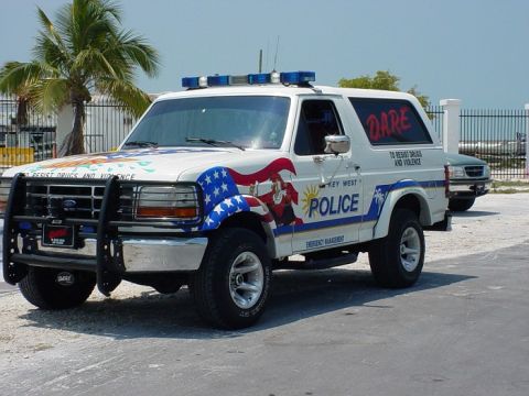 1994 Ford Bronco - This modified SUV is decorated with 'DARE' and patriotic imagery, serving as a Key West Police vehicle.