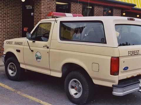 1994 Ford Bronco - This 1994 Ford Bronco is marked for Forest Service use, 'FOREST RANGER' text and an emblem.