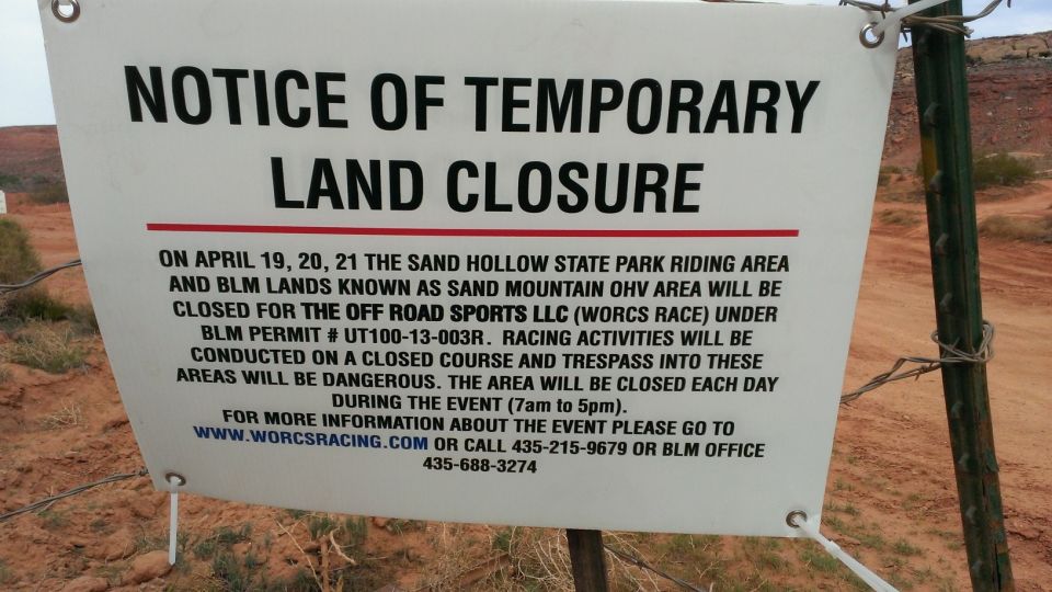 Notice of Temporary Land Closure sign with event details and contact information