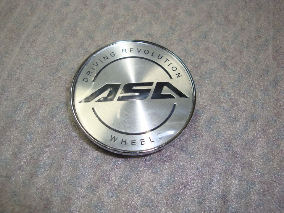 ASA wheels center cap with text "DRIVING REVOLUTION WHEELS"