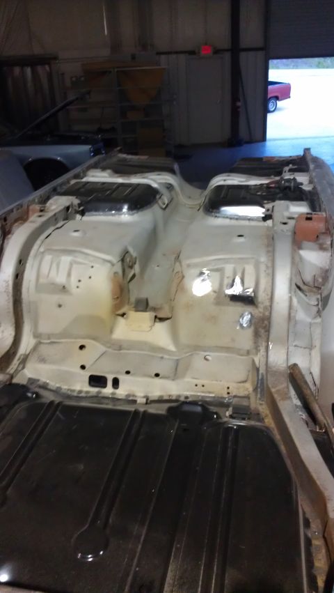 1972 Pontiac Trans Am - The floor pan of a car is visible, stripped down and ready for restoration work.