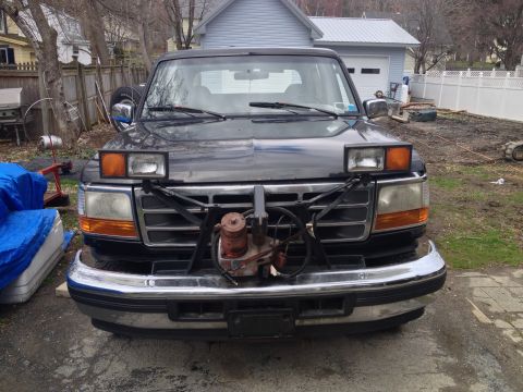 1996 Ford Bronco - Front view of a 1995 Ford Bronco equipped with a plow mount.