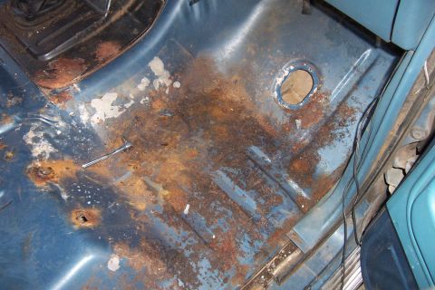 1980 Ford Bronco - The floor pan of this vehicle shows significant rust damage and wear.