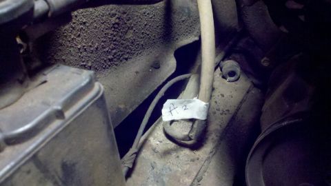 1978 Ford Bronco - A label marked "A 2" is attached to a wire bundle in a dusty engine compartment.