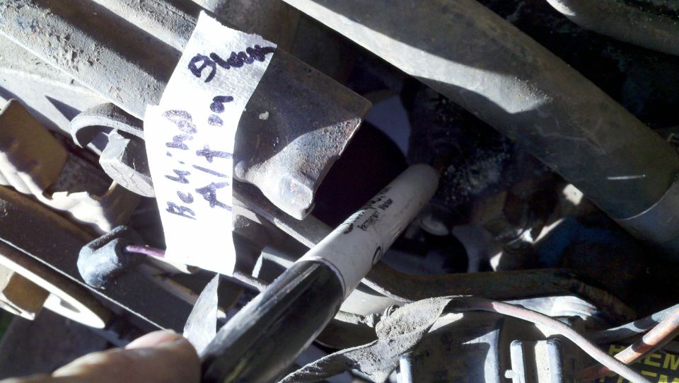 Engine parts with a white label reading 'Blown Bch/1978'. A black marker is also visible