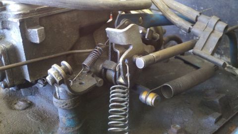 1978 Ford Bronco - Carburetor linkage and springs detail shot.