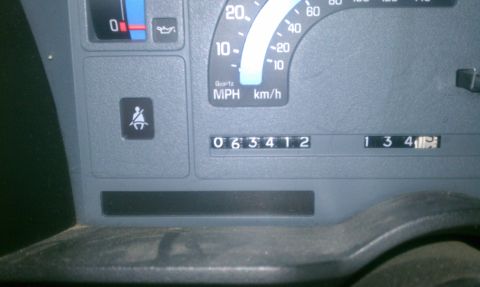 1991 Chevrolet S10 - Dashboard gauges display odometer reading 063412 and trip meter 134.1, with the seatbelt light on.