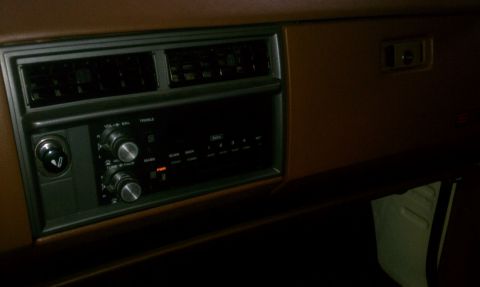1991 Chevrolet S10 - Close-up of a vehicle's dashboard, focusing on the radio and climate controls.