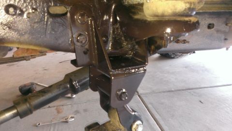 1994 Ford Bronco - Detail shot of the vehicle's frame and suspension system, showing various brackets and bolts.