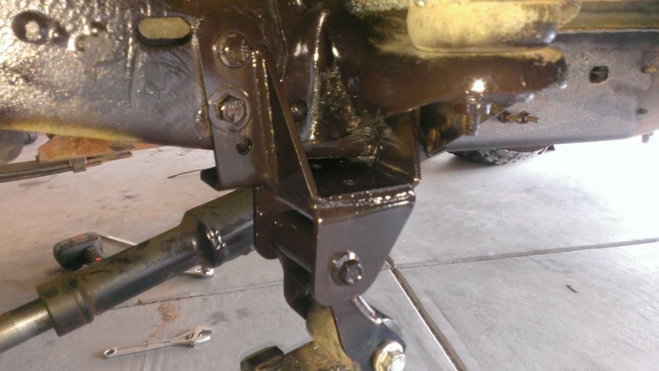 Close-up of vehicle frame and suspension components