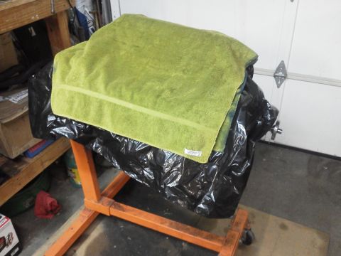 1988 Ford Bronco - Engine block on an engine stand, covered for protection.