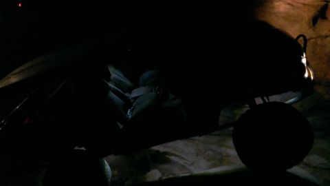1994 Ford Bronco - The interior of a vehicle is visible in the dark, with the Supermotors website logo present.