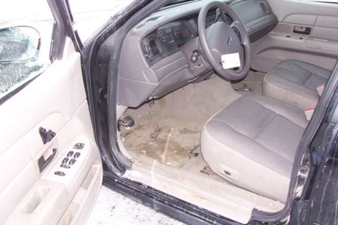 2007 Ford Crown Victoria - Interior view of a 2007 Ford Crown Victoria, showing the driver's side and passenger seats.