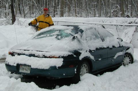 1998 Ford Taurus - Clearing snow from a 1998 Ford Taurus after a winter storm. The car is heavily covered.